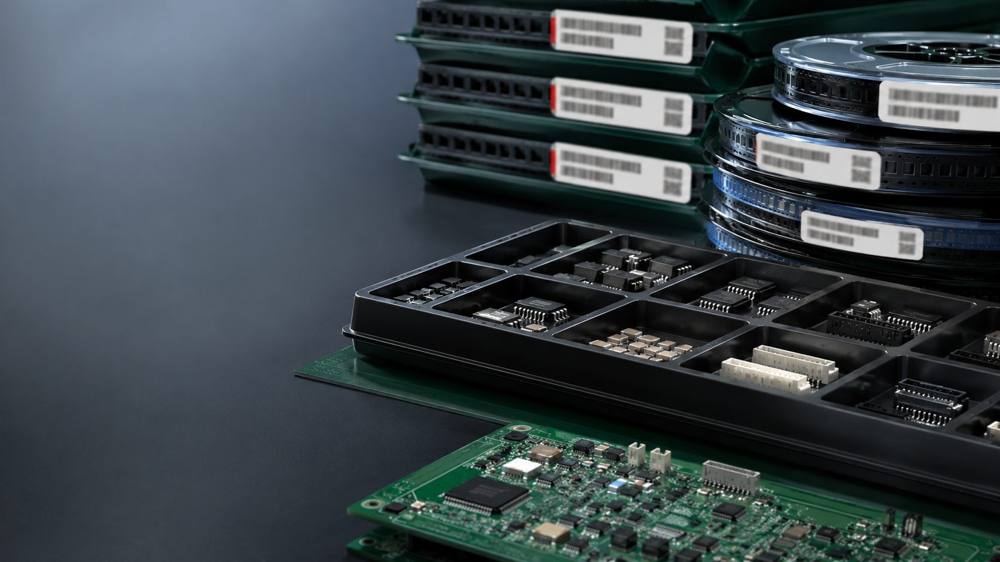 Reeled and tray-packed electronic components ready for assembly